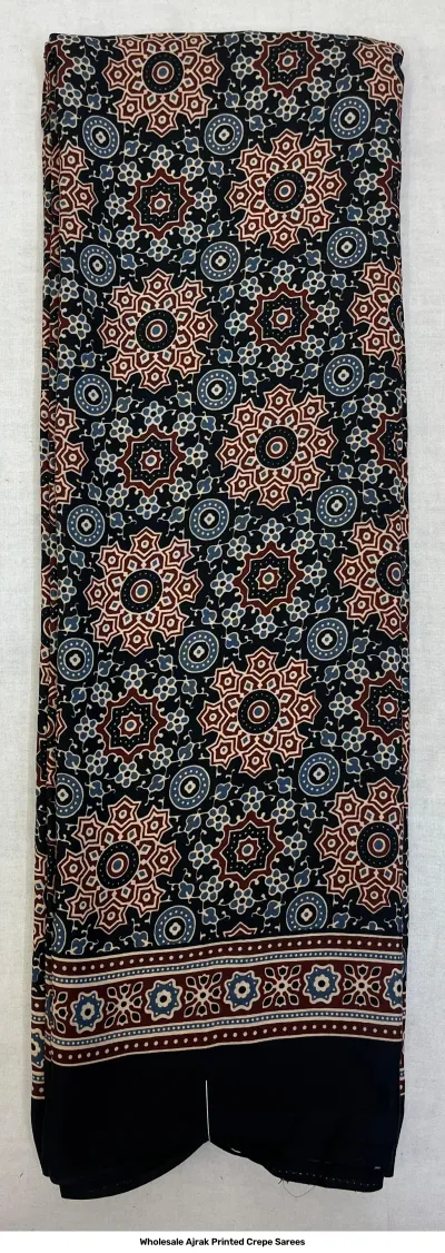 Wholesale Ajrak Printed Crepe Sarees: Single saree with black base and repeating circular floral Ajrak print.