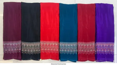 Wholesale Ajrak Printed Crepe Sarees: Catalog layout showing a black background saree with circular motifs and folded fabric options.