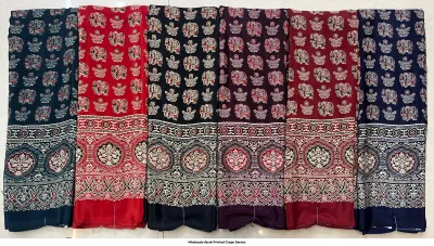 Wholesale Ajrak Printed Crepe Sarees: Catalog layout featuring a red saree with circular and floral Ajrak block prints and fabric samples.