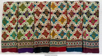 Wholesale Ajrak Printed Crepe Sarees: Catalog layout of a black saree with leaf and circular patterns along with folded fabric swatches.