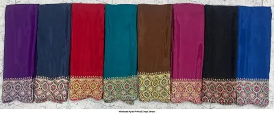 Wholesale Ajrak Printed Crepe Sarees: Six folded sarees in different colors with uniform polka-dot and floral Ajrak prints.