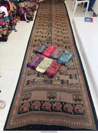 Wholesale Ajrak Printed Crepe Sarees: Catalog layout showcasing a black background saree with large elephant and circular Ajrak prints.