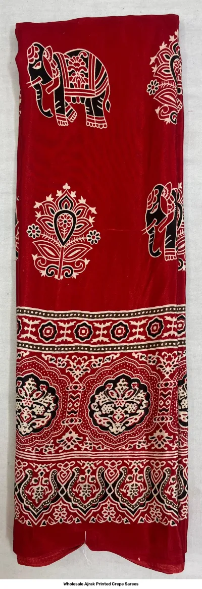 Wholesale Ajrak Printed Crepe Sarees: Six folded sarees in vibrant colors with traditional leaf Ajrak block prints.