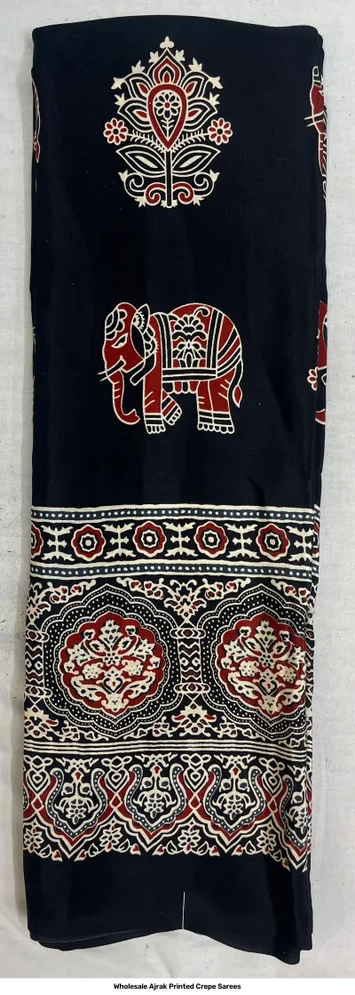 Wholesale Ajrak Printed Crepe Sarees: Six colorful folded sarees with intricate repeating geometric floral Ajrak print patterns.