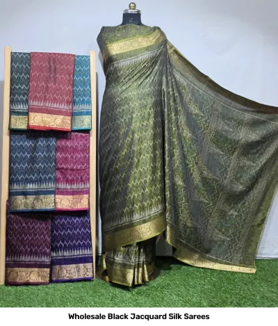 Wholesale Black Jacquard Silk Sarees: Green patterned saree with gold zari border, displayed on mannequin with assorted color variations on rack.