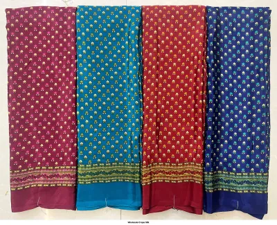 Wholesale Crepe Silk saree, repeated small floral motif on dark base colors with decorative borders.