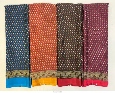 Wholesale Crepe Silk saree, repeated small floral motif on blue, red, black, and purple base.