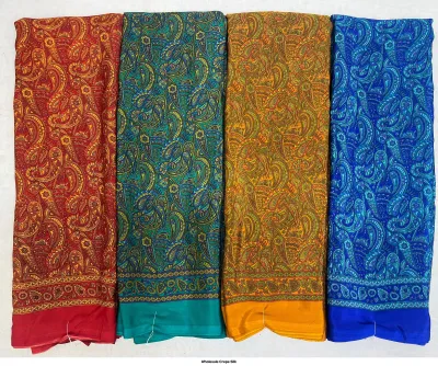 Wholesale Crepe Silk saree, large paisley floral print on red, green, yellow, and blue base.