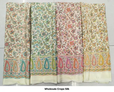 Wholesale Crepe Silk saree, off-white base with multi-colored floral and paisley print pattern.