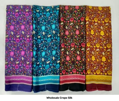 Wholesale Crepe Silk saree, dark floral print on purple, blue, black, and red base with border.