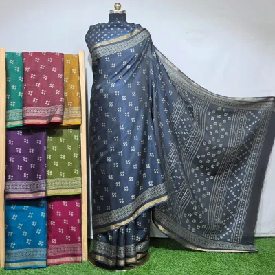 Wholesale Discharge Print Black Pearl Cotton Sarees: A dark grey cotton saree with a small white geometric discharge print and gold zari border details.