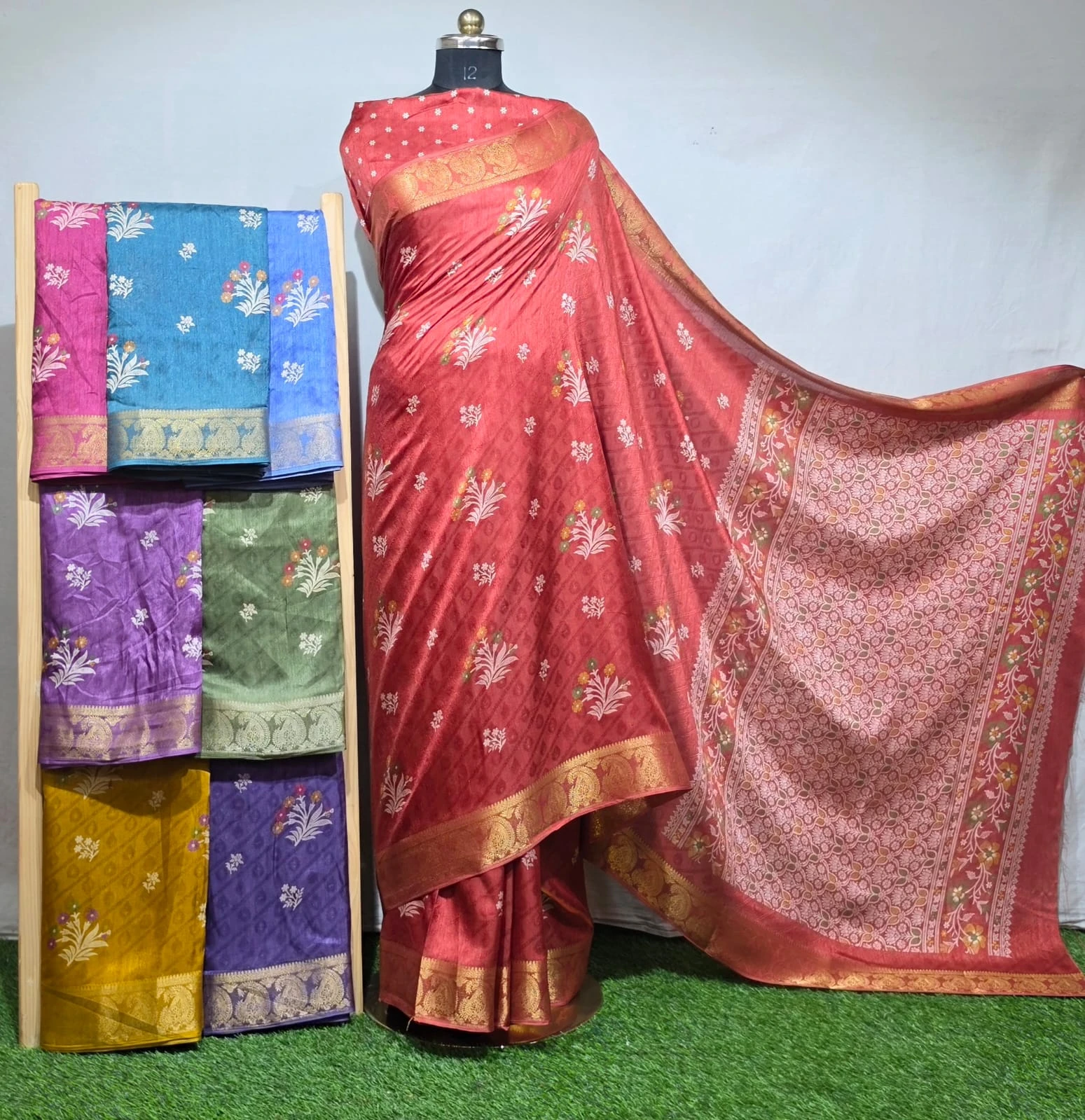 Wholesale Discharge Print Self Jacquard Dola Silk Saree with Jacquard Border: Red saree, floral discharge print, self-jacquard pattern, gold zari-work border.