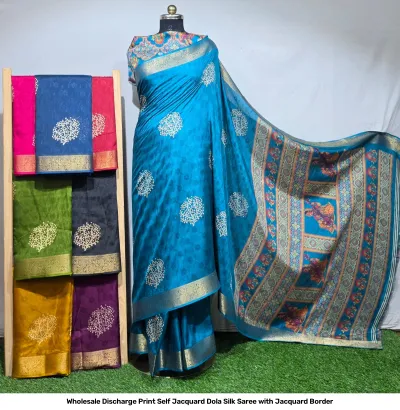 Wholesale Discharge Print Self Jacquard Dola Silk Saree with Jacquard Border: Blue saree, tree-motif discharge print, self-jacquard pattern, gold zari-work border.