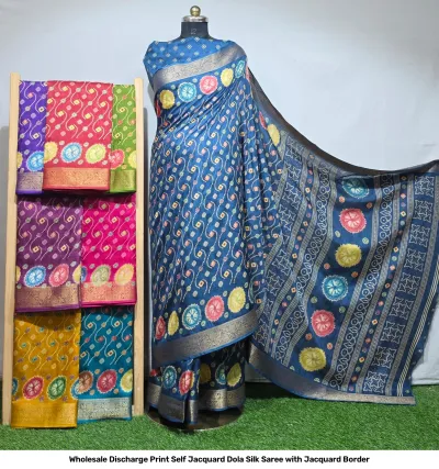 Wholesale Discharge Print Self Jacquard Dola Silk Saree with Jacquard Border: Blue saree, circular discharge print, self-jacquard pattern, gold zari-work border.
