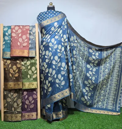 Wholesale Discharge Print Self Jacquard Dola Silk Saree with Jacquard Border: Blue saree, leaf-motif discharge print, self-jacquard pattern, gold zari-work border.