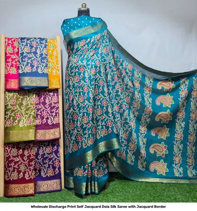 Wholesale Discharge Print Self Jacquard Dola Silk Saree with Jacquard Border: Teal saree, floral discharge print, self-jacquard pattern, gold zari-work border.