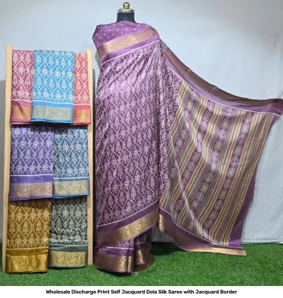 Wholesale Discharge Print Self Jacquard Dola Silk Saree with Jacquard Border: Purple saree, geometric floral discharge print, self-jacquard pattern, gold zari-work border.