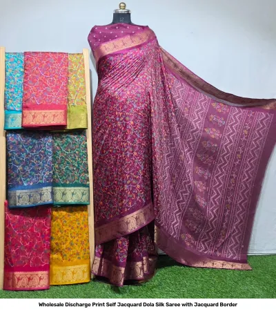 Wholesale Discharge Print Self Jacquard Dola Silk Saree with Jacquard Border: Magenta saree, intricate floral discharge print, self-jacquard pattern, gold zari-work border.