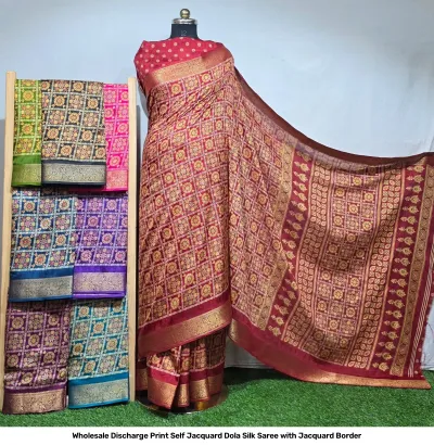 Wholesale Discharge Print Self Jacquard Dola Silk Saree with Jacquard Border: Maroon saree, checkered floral discharge print, self-jacquard pattern, gold zari-work border.
