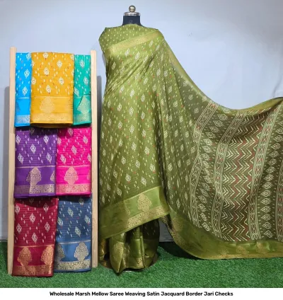 Wholesale Marsh Mellow Saree Weaving Satin Jacquard Border Jari Checks olive green satin saree with diamond jacquard pattern and folded sarees on rack.